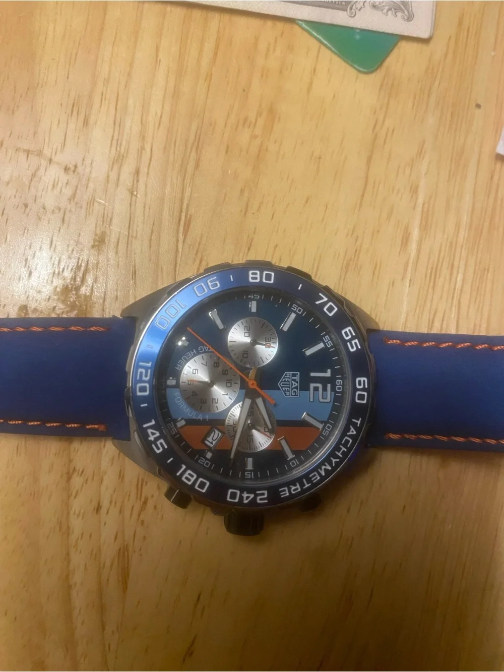 New Tag Heuer Blue Dial Watch with Orange Accents